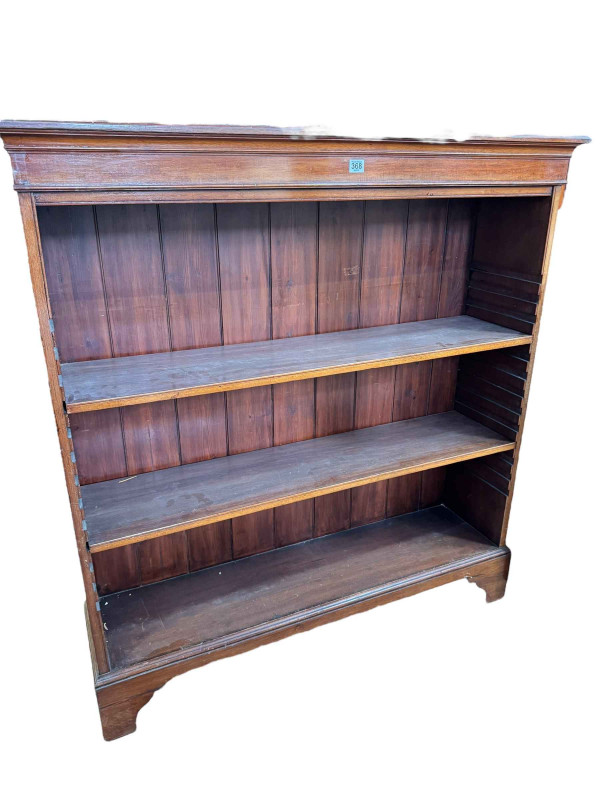Mahogany open bookcase having two adjustable shelves, 128cm by 120cm by 32cm.