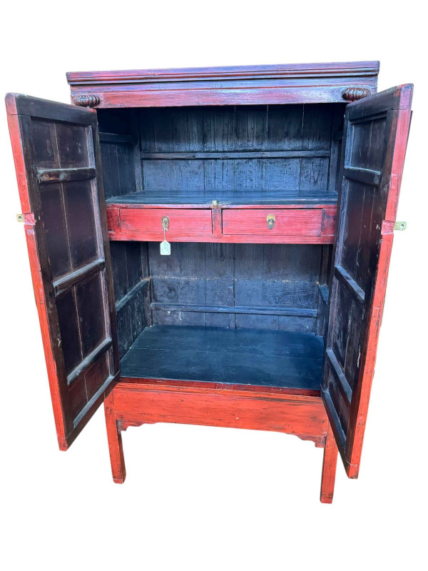 Chinese red lacquered two door wedding cabinet having two internal drawers, 176cm by 102cm by 66cm.