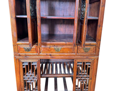 Chinese lacquered wedding cabinet having four fretwork panel doors above three drawers with four sliding fretwork doors below, 179.5cm by 100.5cm by 57cm. thumbnail