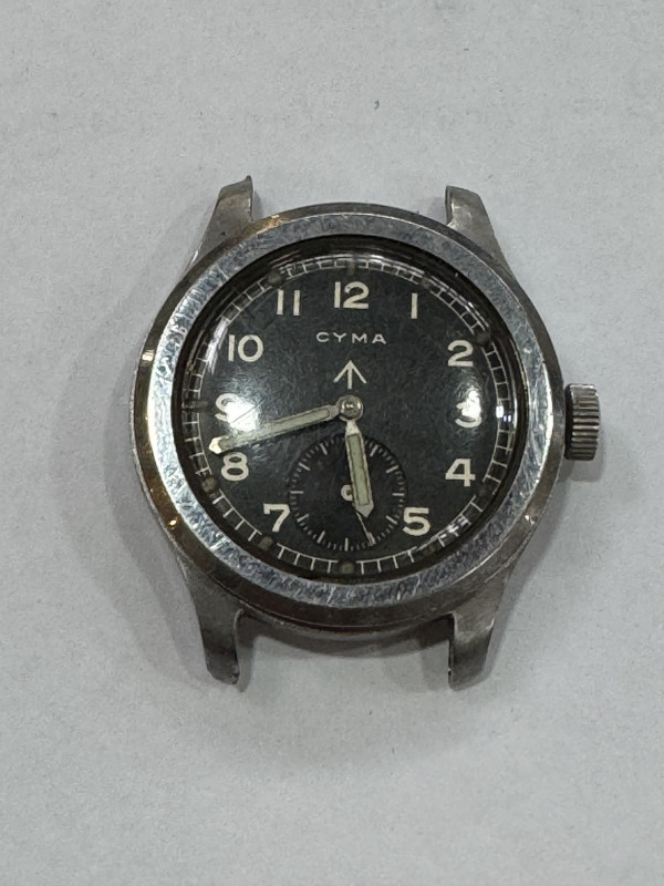 Two boxes of pocket and wristwatches including CYMA WWII military issue steel wristwatch, costume jewellery, lighters, etc.