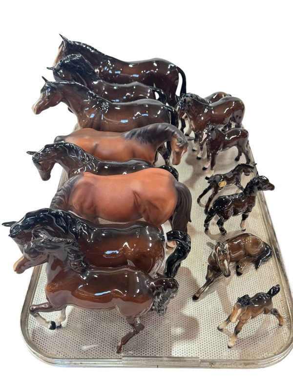 Fifteen Beswick and Royal Doulton horses and foals.