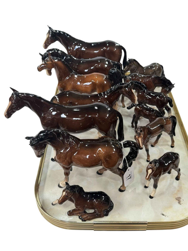 Thirteen Beswick and Royal Doulton horses and foals.
