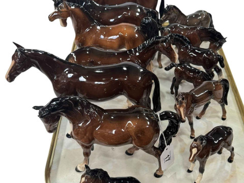 Thirteen Beswick and Royal Doulton horses and foals.