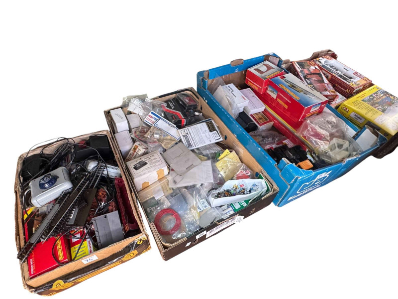 Four boxes of model railway and model boat accessories, model kits, etc.