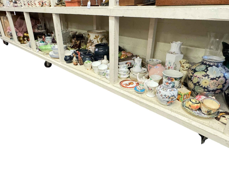 Large collection of decorative pottery, books, glass petal vase, carved table, etc.