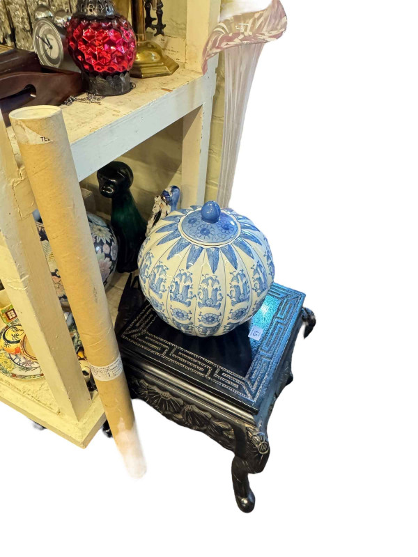 Large collection of decorative pottery, books, glass petal vase, carved table, etc.