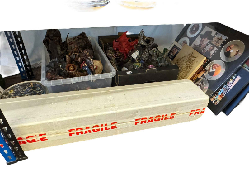 Collection of John Wayne memorabilia, dragon figures, collectors plates, etc.