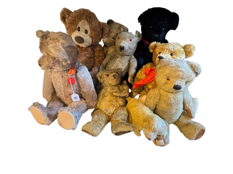 Large collection of soft toys and teddy bears.