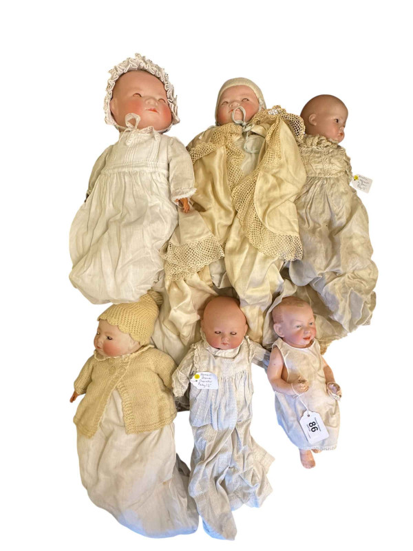 Six antique bisque head baby dolls including Kammer and Reinhardt, Schoena and Hoffmeister, Hermann Steiner, etc.