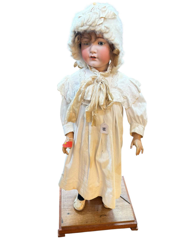 Large Cuno Otto Dressel child doll on wooden plinth (doll 97cm).