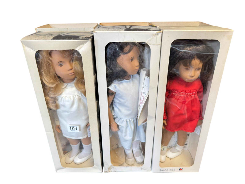 Three Sasha dolls, Brunette in red dress, Honey Blonde hair silk dress and other, all boxed.