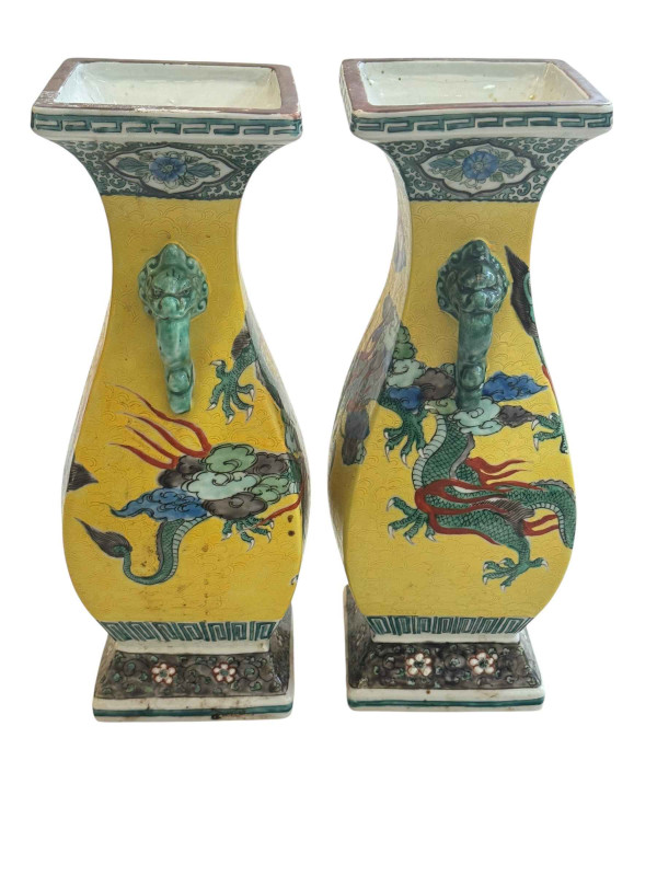 Pair Chinese two handle vases with dragon decoration, 30cm.
