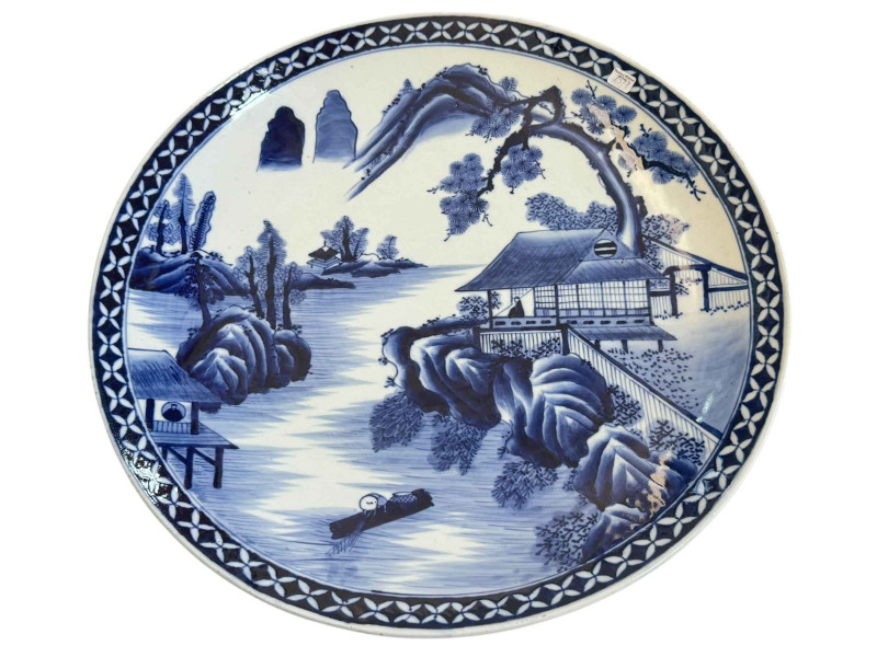 Large blue and white Chinese charger decorated with house on lake in landscape scene, 46cm diameter.