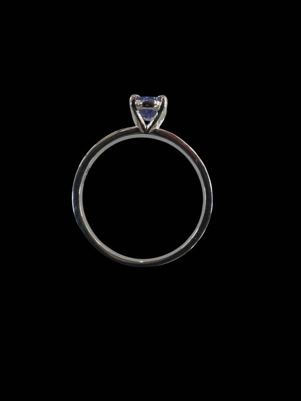 18 carat white gold and oval tanzanite single stone ring, size M.