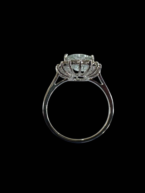 18 carat white gold, aquamarine and diamond cluster ring, size O.