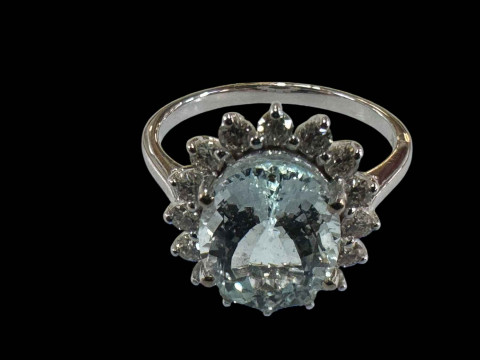18 carat white gold, aquamarine and diamond cluster ring, size O.