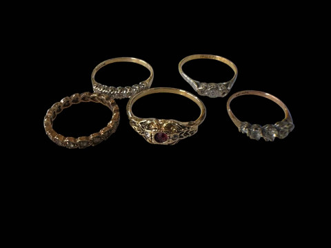Collection of five rings, some gold.