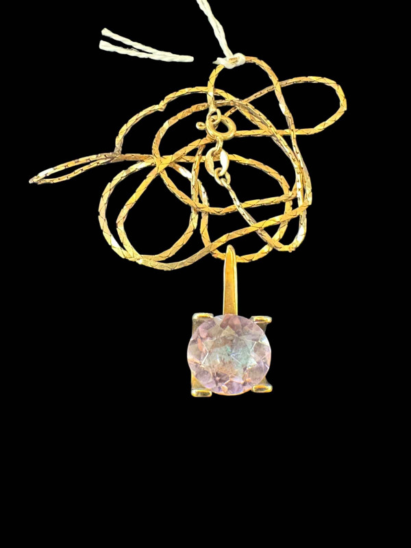 Amethyst pendant with gold mount and 10k chain.