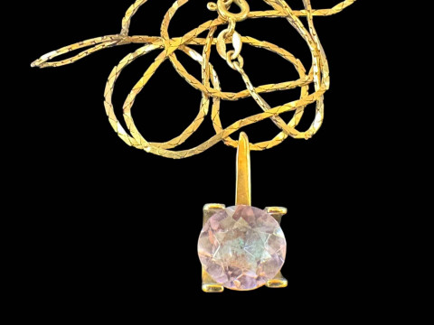 Amethyst pendant with gold mount and 10k chain.