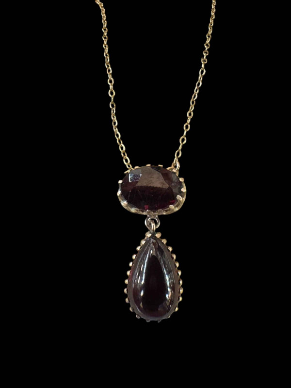 Garnet two stone pendant with 9 carat gold chain.