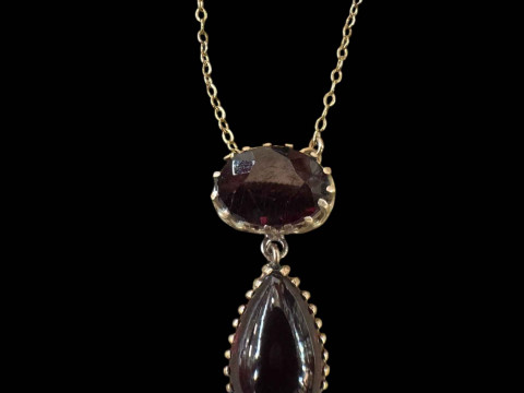 Garnet two stone pendant with 9 carat gold chain.