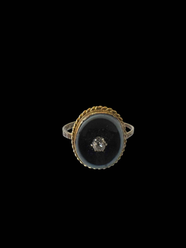 Early 19th Century gold mourning ring with diamond on onyx and hair locket, inscribed John Birket 1819, size R.