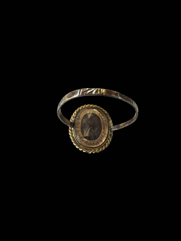 Early 19th Century gold mourning ring with diamond on onyx and hair locket, inscribed John Birket 1819, size R.