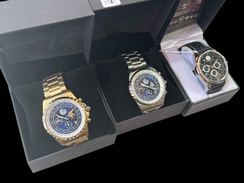 Three Apollo wristwatches.