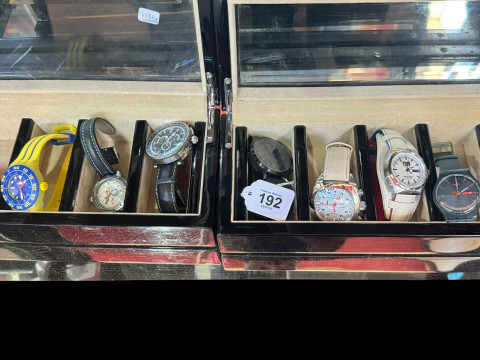 Two watch display boxes with seven watches.