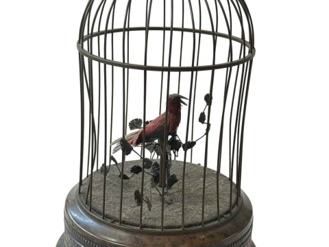Musical bird in cage with wind up mechanism, 27cm.