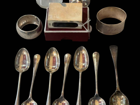 Silver matchbox holder, silver napkin rings, teaspoons, egg cup and hair...