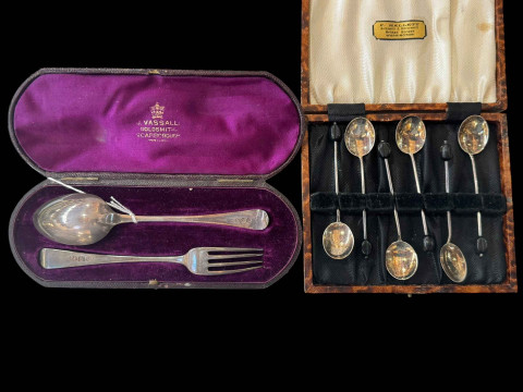 Silver christening spoon and fork, and set of silver coffee spoons, cased...