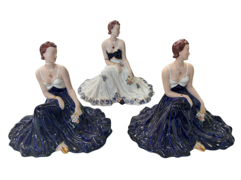 Three Royal Dux seated ladies.