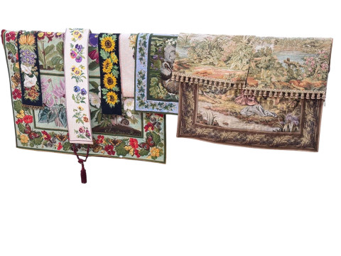 Six needlework wall hangings and three tapestry wall hangings (9).