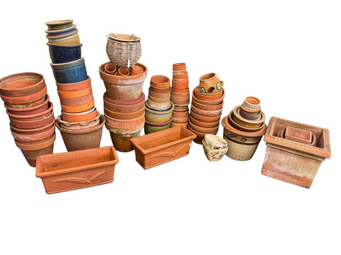 Large quantity of terracotta and other garden planters.