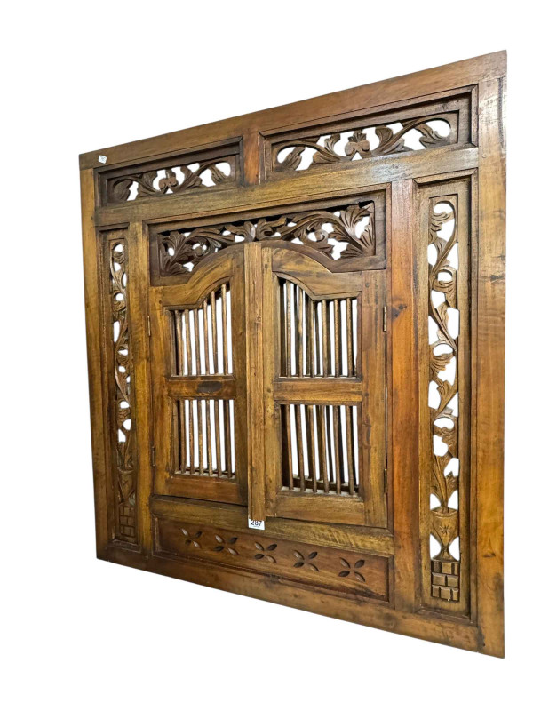 Carved hardwood wall mirror with shutter doors, 90cm by 79cm.