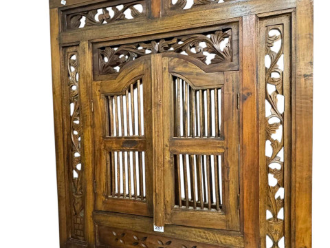 Carved hardwood wall mirror with shutter doors, 90cm by 79cm.