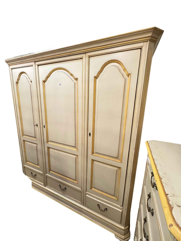 French Louisiane three piece bedroom suite comprising three door armoire with three base drawers, turned leg dressing table and slim six drawer chest.