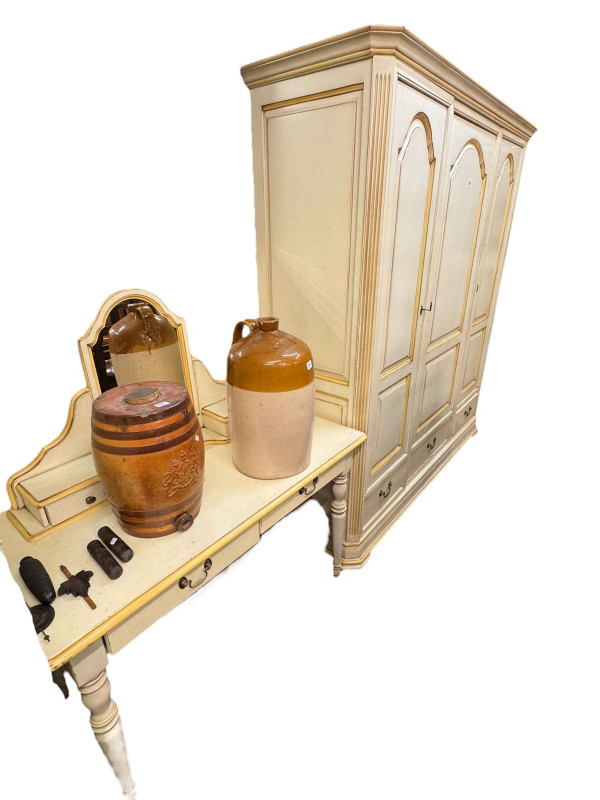 French Louisiane three piece bedroom suite comprising three door armoire with three base drawers, turned leg dressing table and slim six drawer chest.