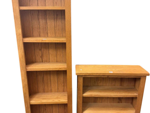 Two light oak open bookcases, largest 170cm by 52cm by 22.5cm.