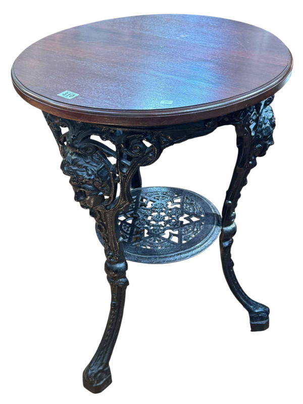 Circular cast base pub table, 75cm by 54cm diameter.