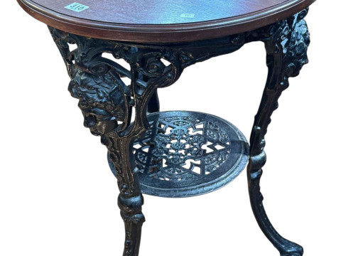 Circular cast base pub table, 75cm by 54cm diameter.