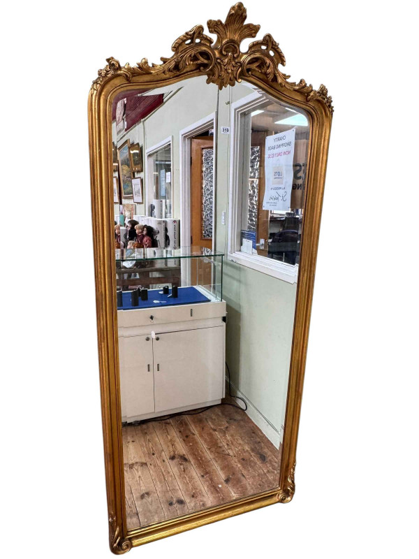 French style rectangular gilt framed arched top bevelled wall mirror, 199cm by 87cm.