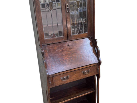 Art Nouveau oak bureau bookcase having two leaded glazed doors above a...