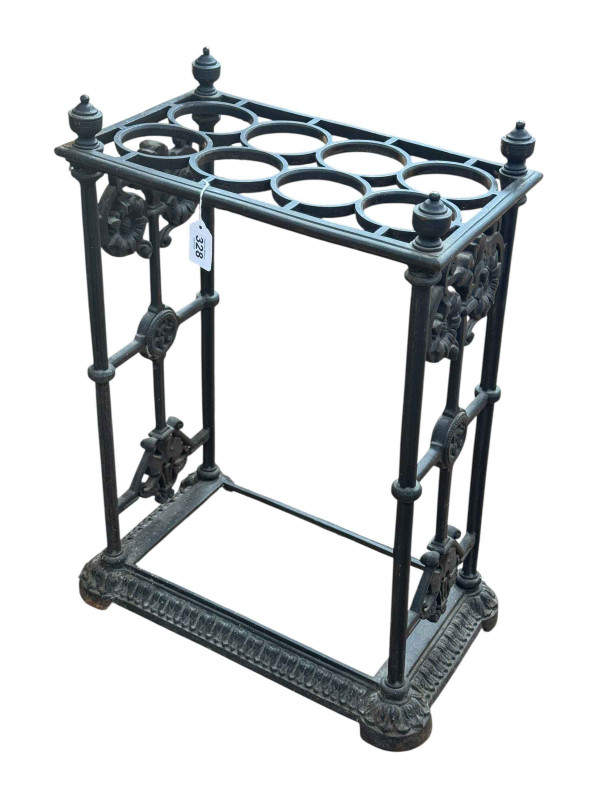 Cast iron eight division stick stand, 64cm by 41cm by 26cm.