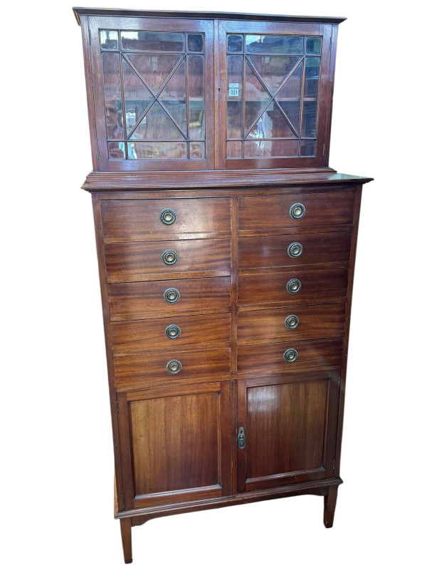 Edwardian mahogany cabinet having two astragal glazed doors above two banks of five drawers with two cupboard doors below, 186cm by 87cm by 47.5cm.