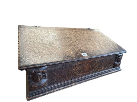 Antique oak triple carved panel front coffer, 58cm by 100.5cm by 39cm, together with an antique oak and marquetry inlaid ledger desk, 32.5cm by 73.5cm by 47cm. thumbnail