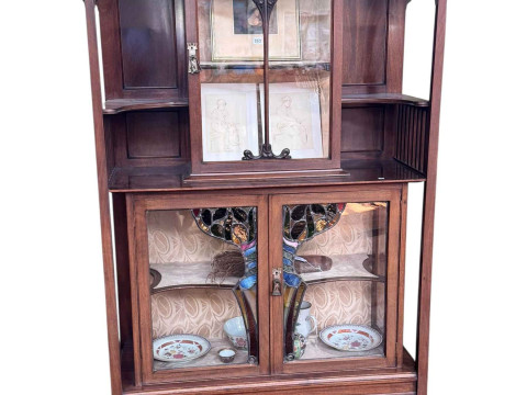 Art Nouveau mahogany cabinet, the canopied top having central glazed panel...
