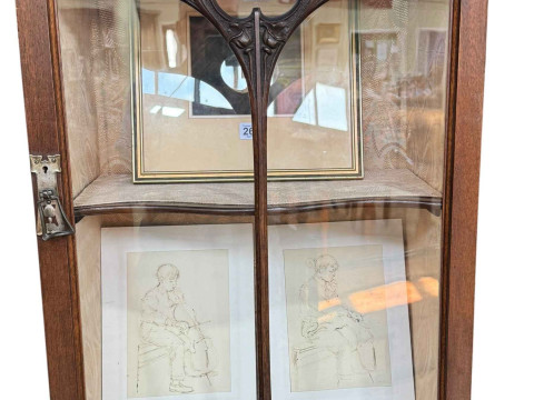 Art Nouveau mahogany cabinet, the canopied top having central glazed panel door flanked by two shaped shelves above two coloured leaded glass panel doors, 183.5cm by 138cm by 46cm. thumbnail