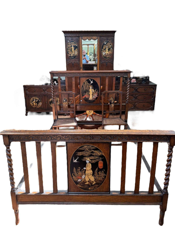 Early 20th Century oak and chinoiserie decorated six piece bedroom suite comprising mirror door wardrobe, three drawer dressing table, two door linen chest and two bedroom chairs and double bedstead.